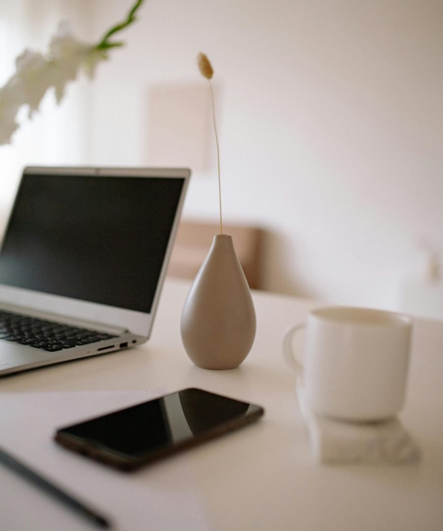 laptop-on-table-with-cup-of-coffee-and-mobile-phone